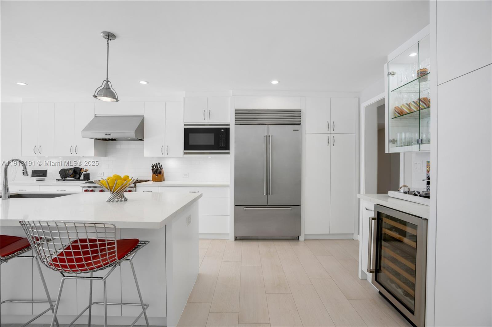 4380 Lake Road Miami, FL 33137 - Photo 22 of 41 a kitchen with stainless steel appliances granite countertop a refrigerator a stove a sink and a microwave