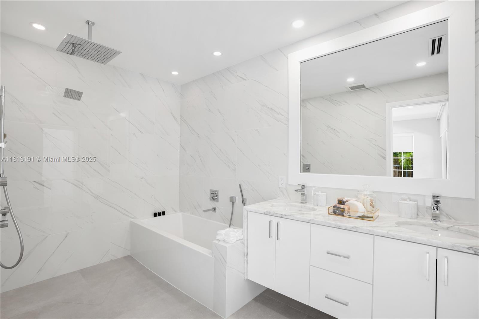 4380 Lake Road Miami, FL 33137 - Photo 27 of 41 a bathroom with a granite countertop sink mirror and double