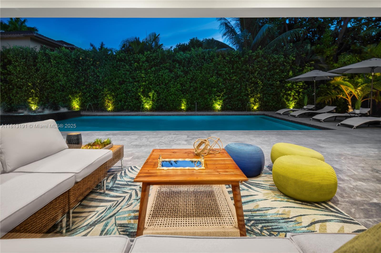 4380 Lake Road Miami, FL 33137 - Photo 37 of 41 a view of swimming pool with seating area and trees in the background