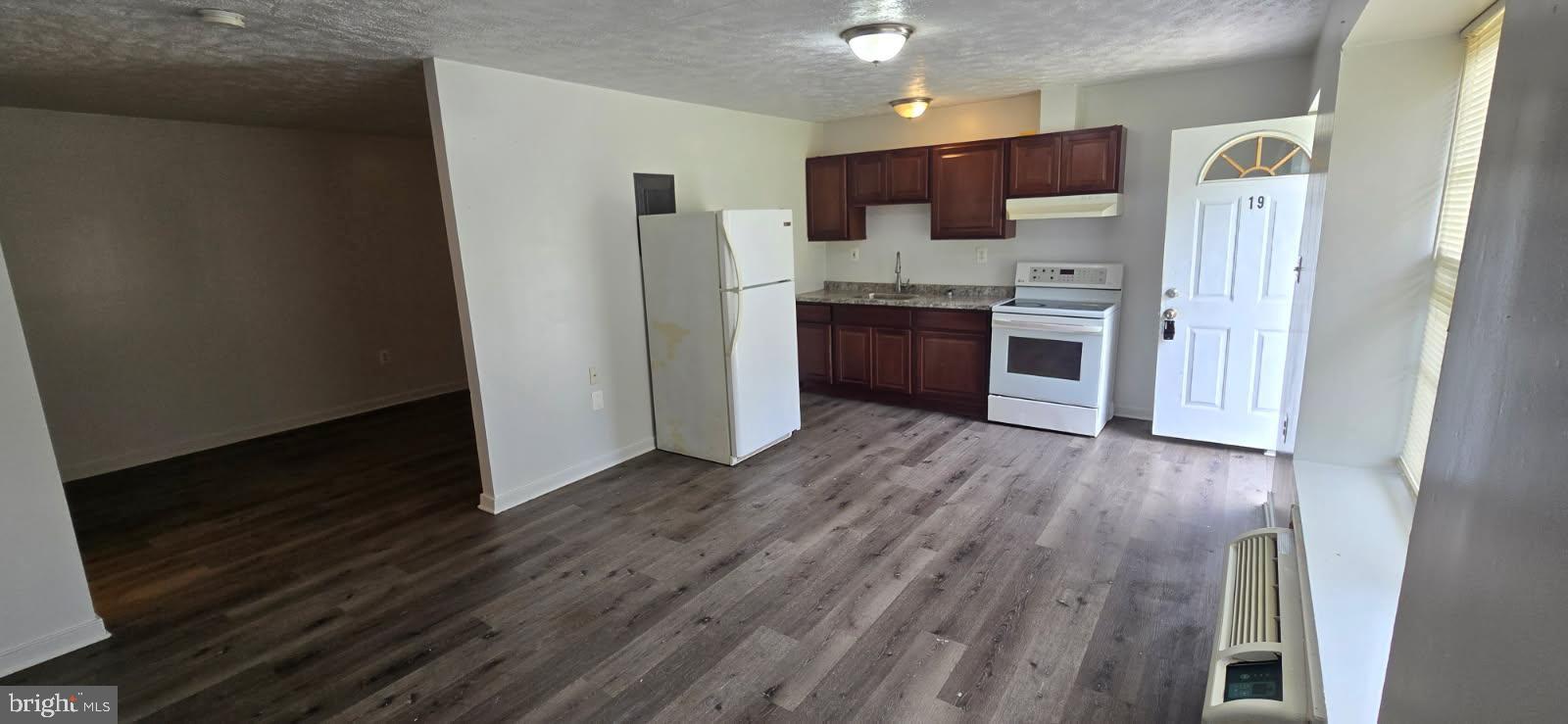 2967 Browns Store Road, Unit 21 Heathsville, VA 22473 - Photo 1 of 2 a kitchen with stainless steel appliances a refrigerator and a stove top oven
