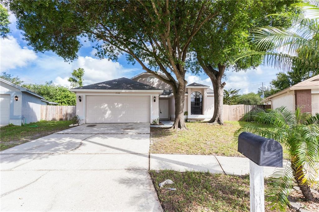 1523 Chepacket Street Brandon, FL 33511 - Photo 1 of 1 a front view of a house with garden