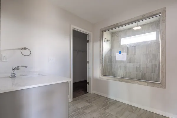 a bathroom with a bathtub and a sink