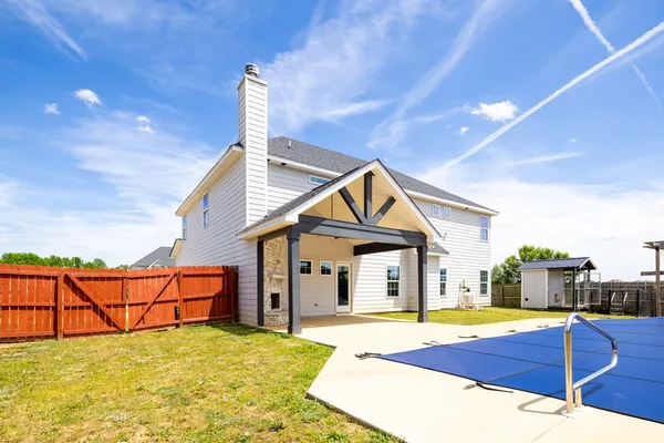 a view of a house with basketball court