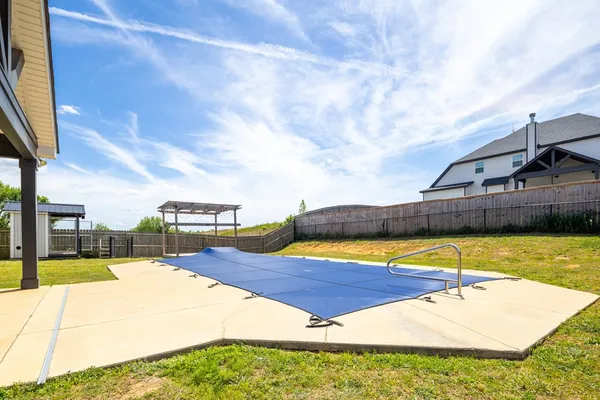 a view of a swimming pool with an outdoor space
