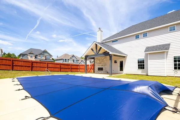 a view of pool with outdoor seating