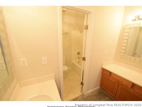 a bathroom with a shower and a sink