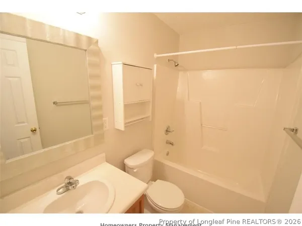 a bathroom with a shower and a bath tub