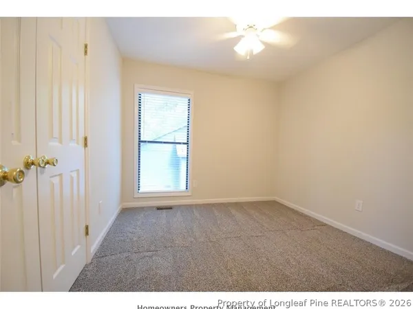 a view of an empty room and a window