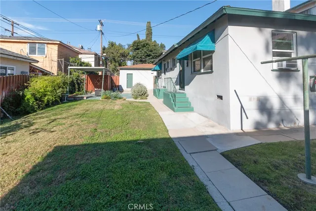 a house view with a garden space