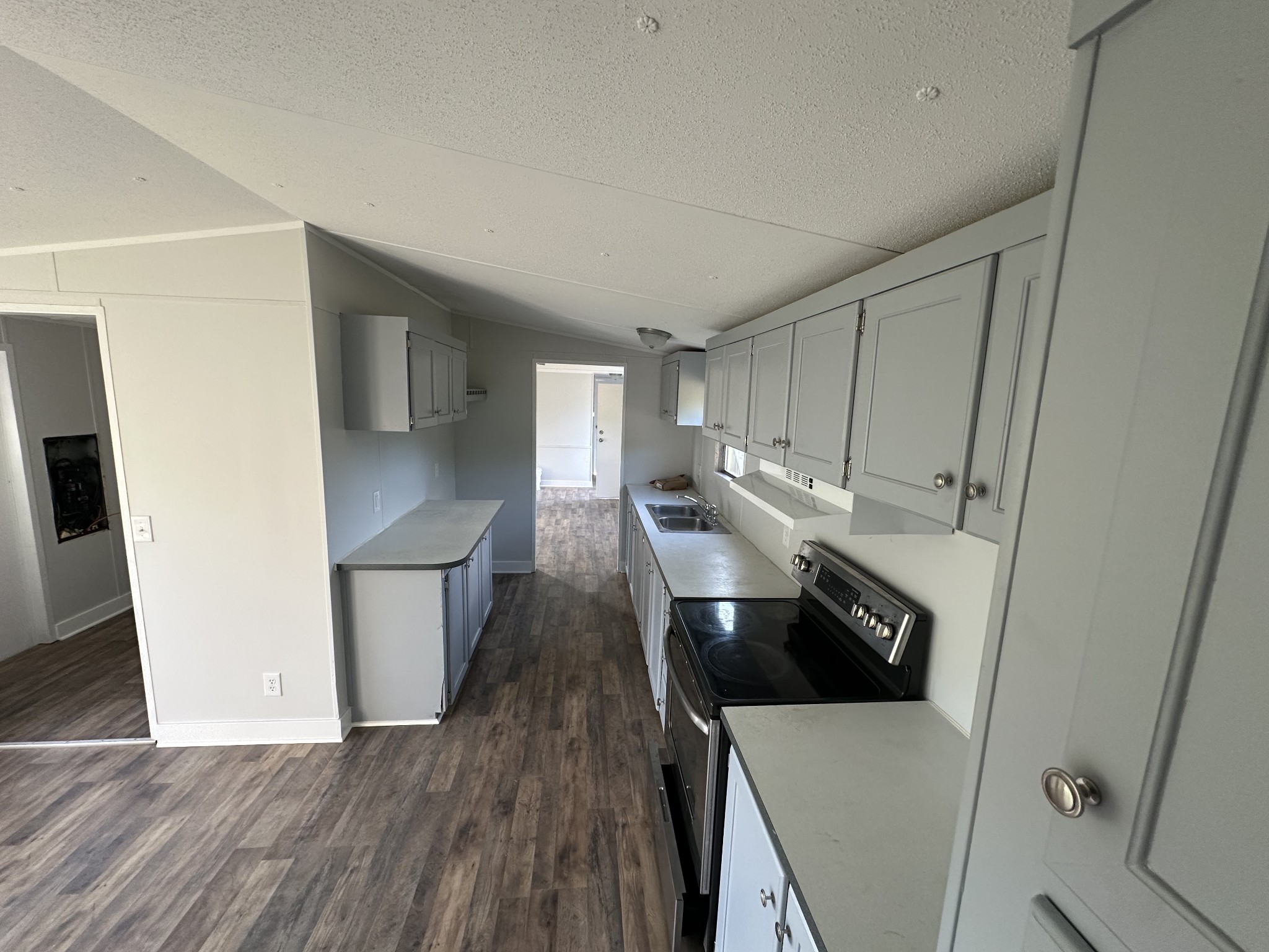 12 Young Road Buffalo Valley, TN 38548 - Photo 6 of 12 a kitchen with a refrigerator sink and wooden floor