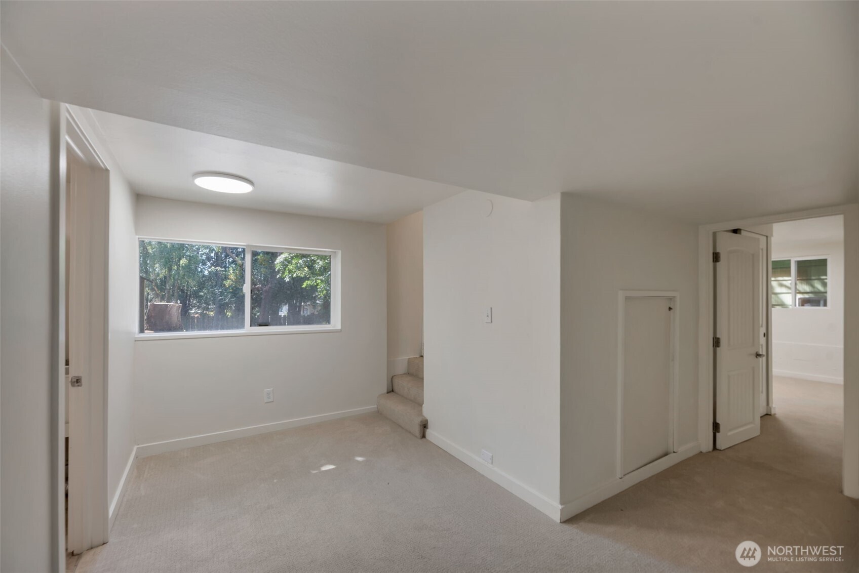 11229 29th Avenue Southwest Seattle, WA 98146 - Photo 17 of 28 an empty room with windows