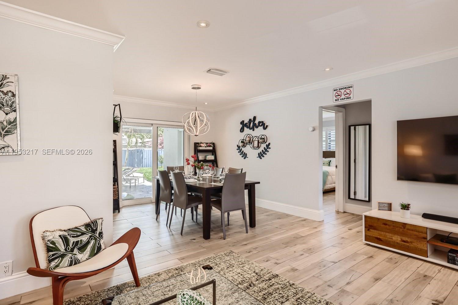 5117 Cleveland Street Hollywood, FL 33021 - Photo 12 of 39 a view of a livingroom with furniture and a flat screen tv