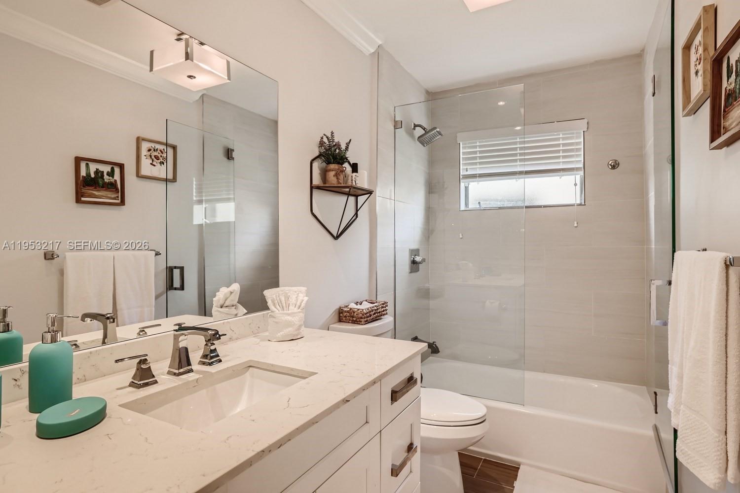 5117 Cleveland Street Hollywood, FL 33021 - Photo 20 of 39 a bathroom with a sink a toilet and shower