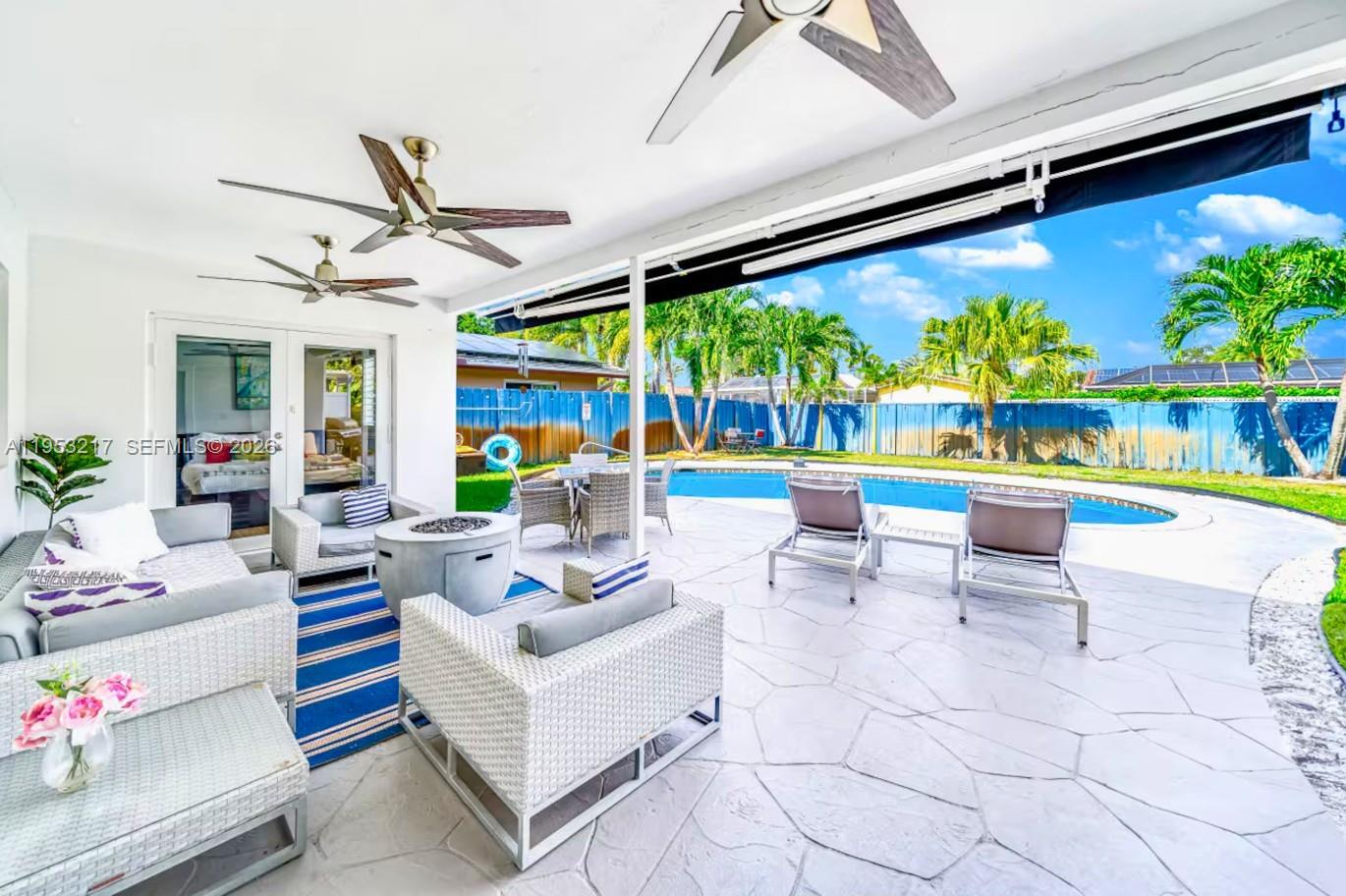 5117 Cleveland Street Hollywood, FL 33021 - Photo 2 of 39 a outdoor living space with furniture and a garden