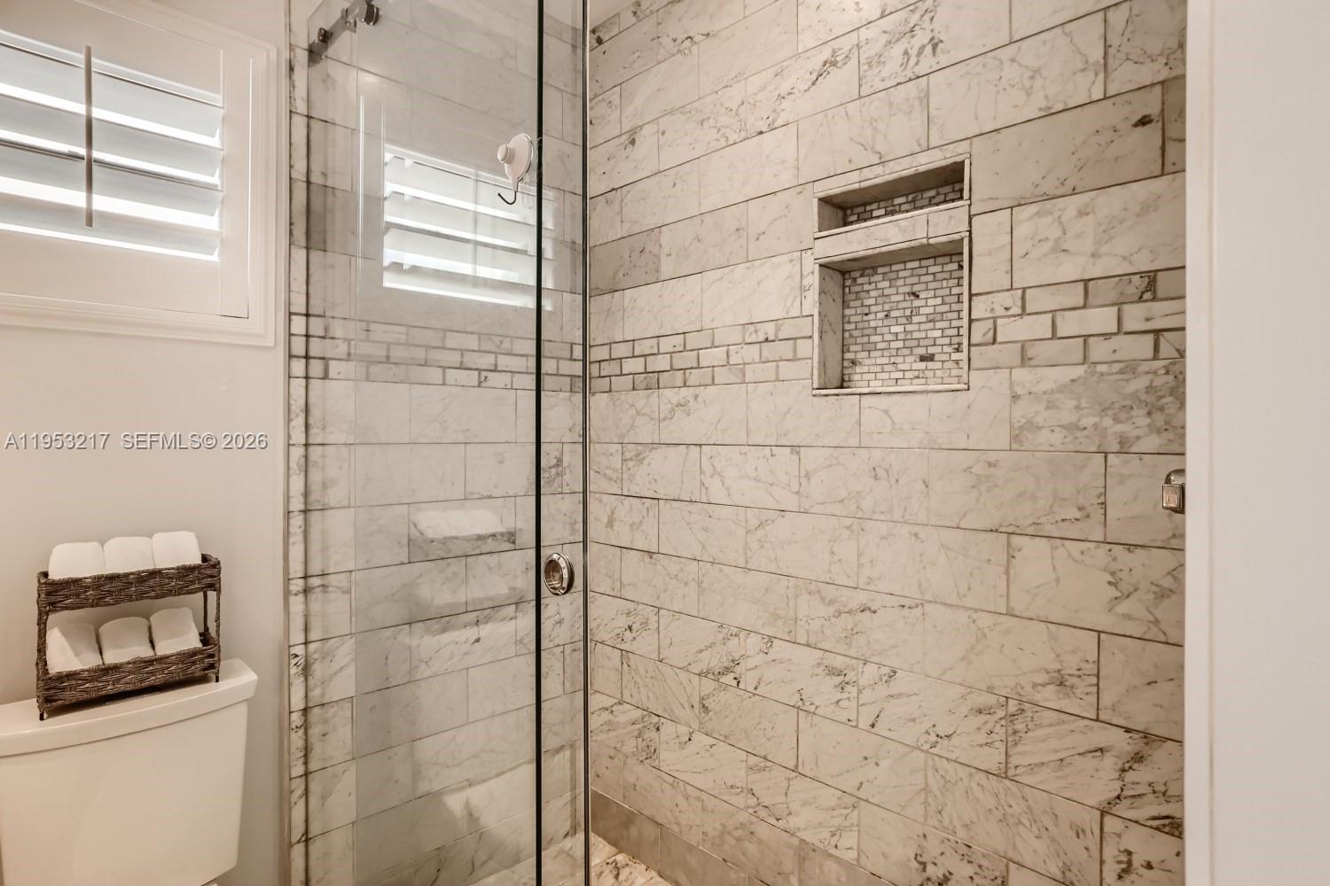 5117 Cleveland Street Hollywood, FL 33021 - Photo 25 of 39 a bathroom with a shower