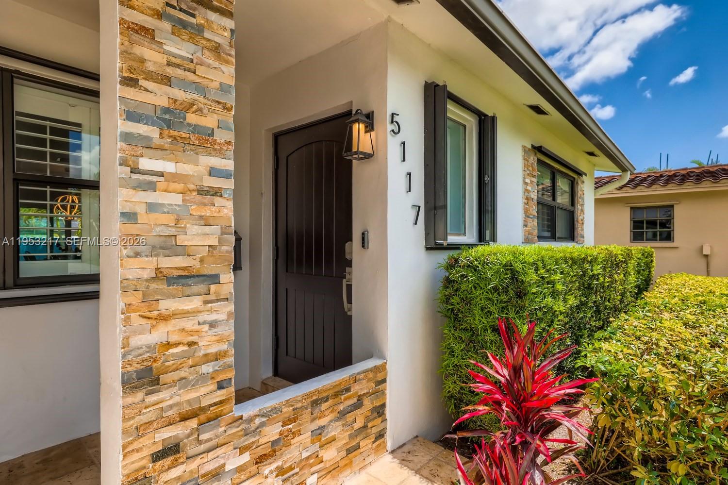 5117 Cleveland Street Hollywood, FL 33021 - Photo 3 of 39 a view of a house with a backyard