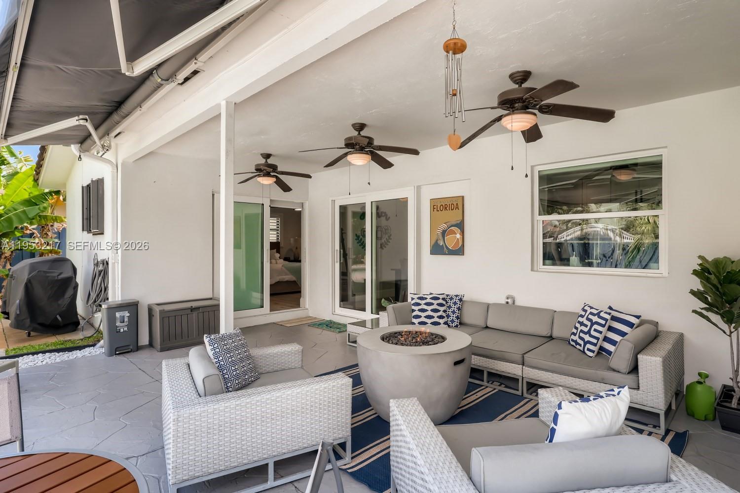 5117 Cleveland Street Hollywood, FL 33021 - Photo 31 of 39 a living room with furniture and a large window