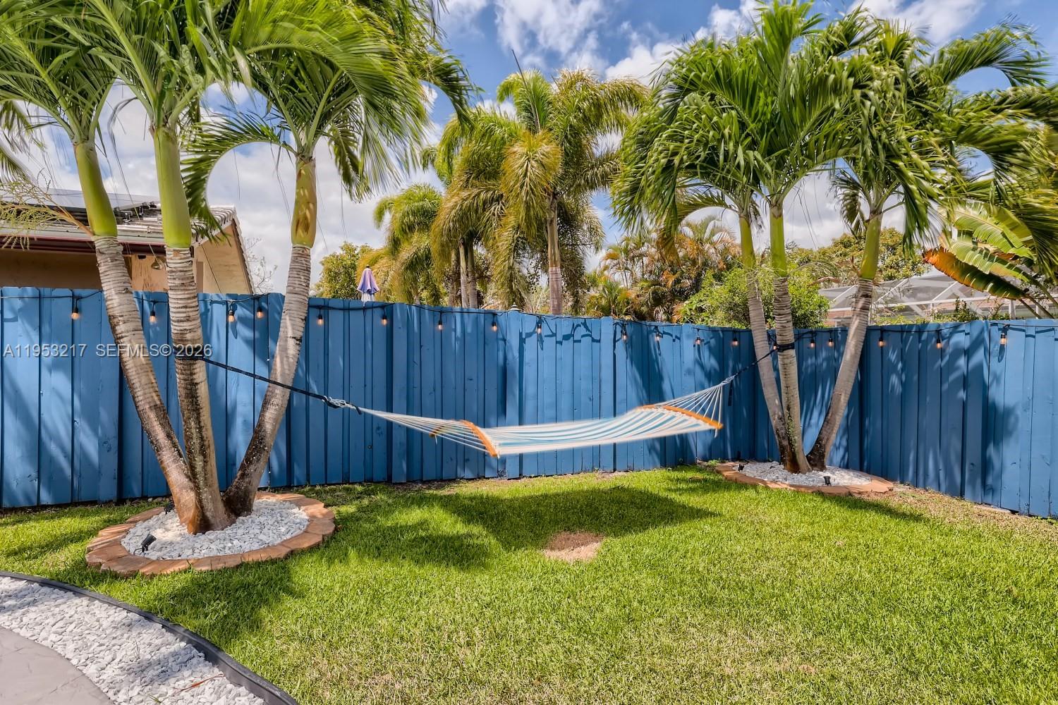5117 Cleveland Street Hollywood, FL 33021 - Photo 34 of 39 a view of a backyard with a garden