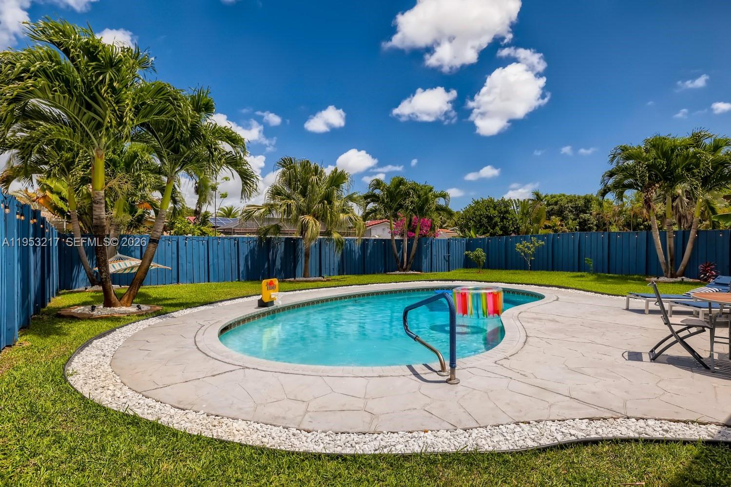 5117 Cleveland Street Hollywood, FL 33021 - Photo 36 of 39 a view of a swimming pool with a yard and sitting area