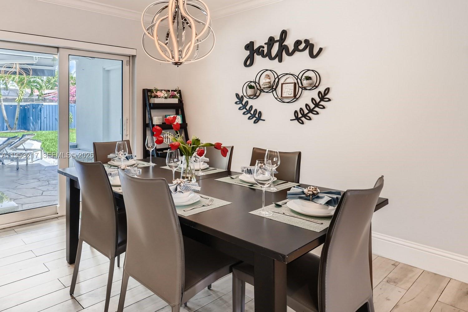5117 Cleveland Street Hollywood, FL 33021 - Photo 10 of 39 a view of a dining room with furniture window and outside view