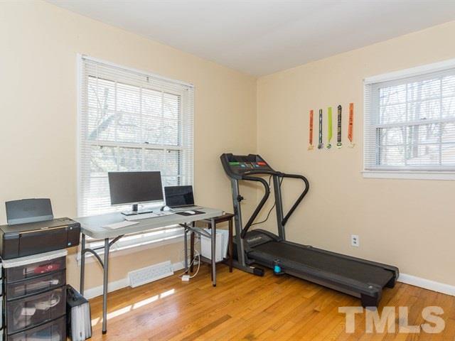 1726 Euclid Road Durham, NC 27713 - Photo 16 of 25 a view of a workspace with furniture and a window
