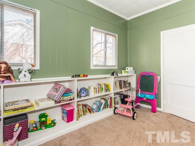 1726 Euclid Road Durham, NC 27713 - Photo 20 of 25 a bedroom with toys and a bed
