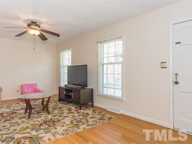 1726 Euclid Road Durham, NC 27713 - Photo 3 of 25 a living room with furniture and a flat screen tv