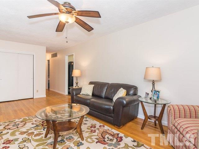 1726 Euclid Road Durham, NC 27713 - Photo 5 of 25 a living room with furniture and a wooden floor