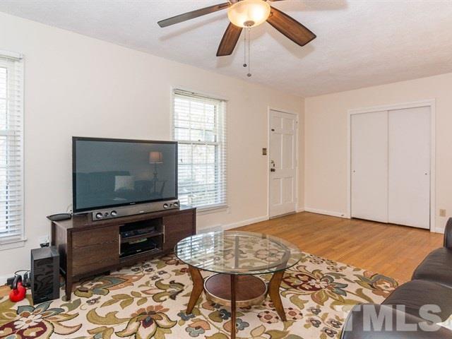 1726 Euclid Road Durham, NC 27713 - Photo 6 of 25 a bedroom with furniture and flat screen tv
