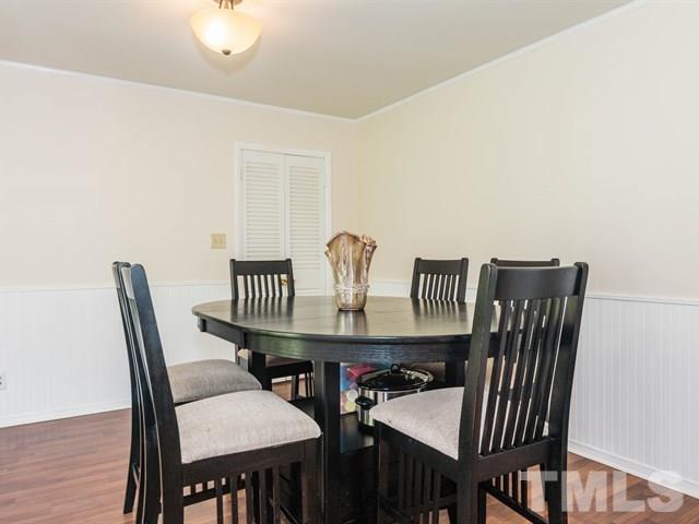 1726 Euclid Road Durham, NC 27713 - Photo 7 of 25 a view of a dining room with furniture and wooden floor