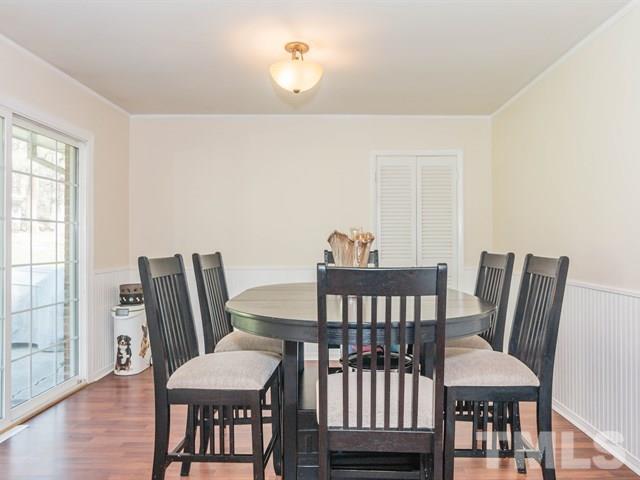 1726 Euclid Road Durham, NC 27713 - Photo 8 of 25 a view of a dining room with furniture and wooden floor