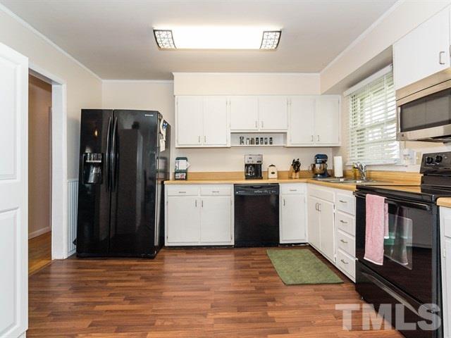 1726 Euclid Road Durham, NC 27713 - Photo 10 of 25 a kitchen with stainless steel appliances granite countertop a refrigerator stove and sink