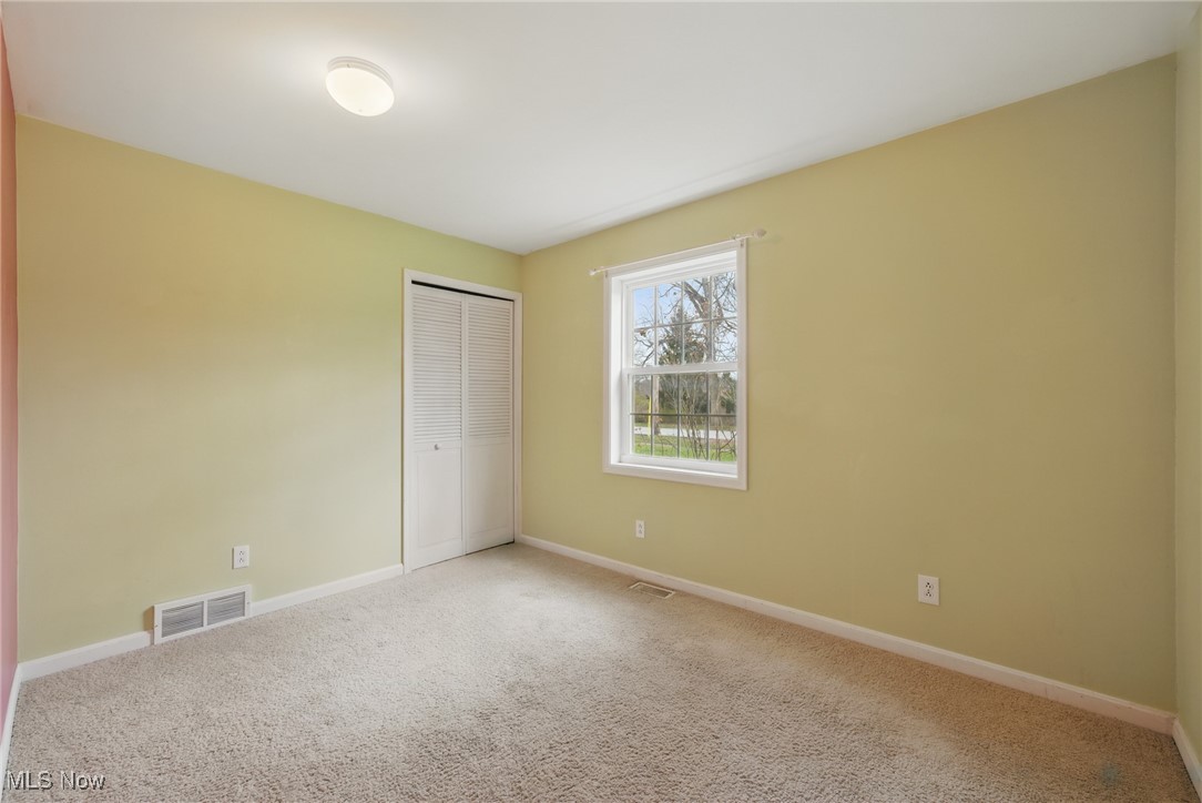 28575 White Road Wickliffe, OH 44092 - Photo 18 of 49 Unfurnished room with carpet flooring, visible vents, and baseboards