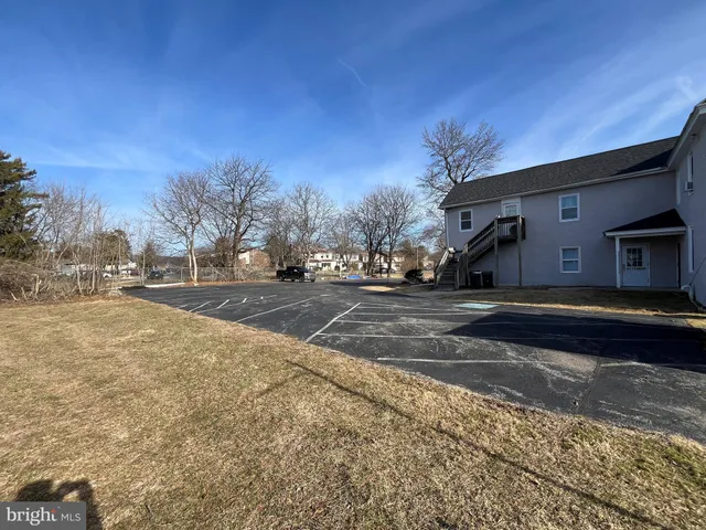 a view of street with large trees