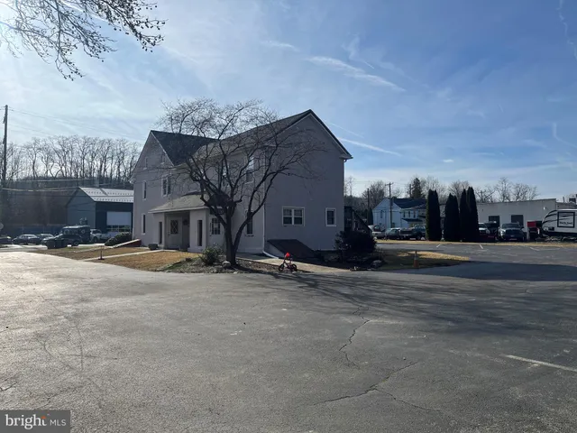 a view of a street with a building in the background