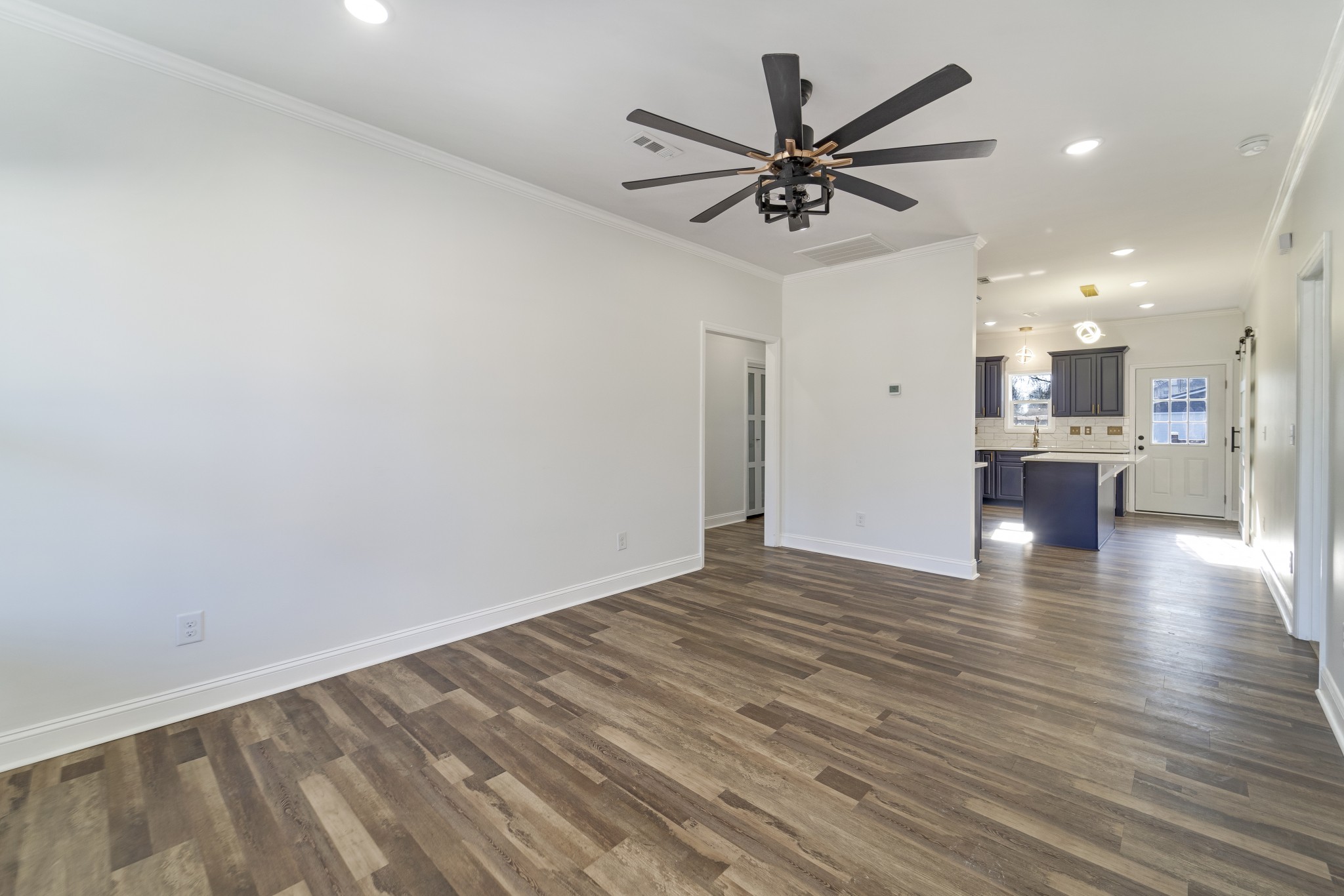 307 Wall Street Mount Pleasant, TN 38474 - Photo 12 of 33 a view of empty room with wooden floor and window