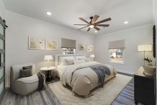 a bedroom with a bed and a couch