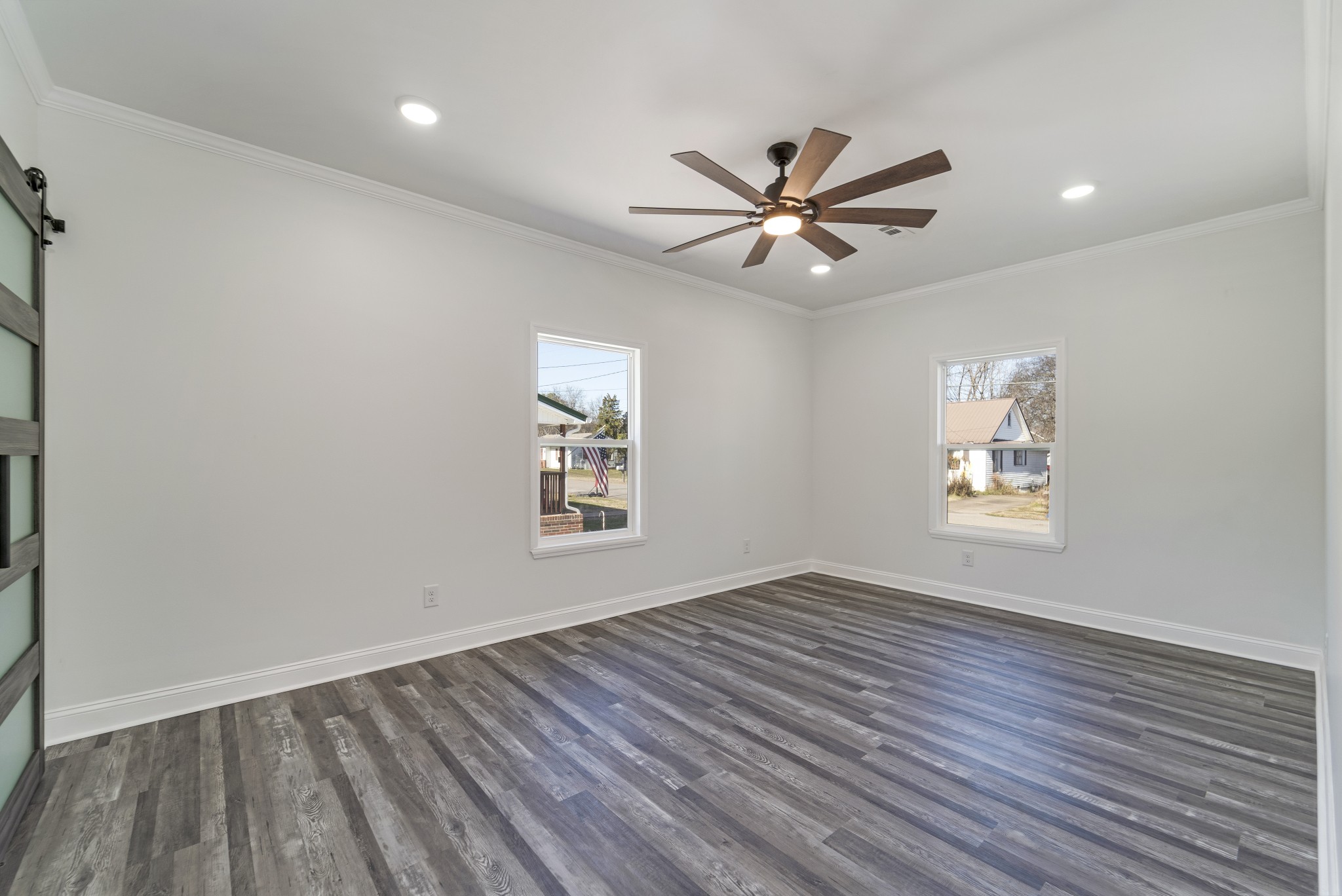 307 Wall Street Mount Pleasant, TN 38474 - Photo 15 of 33 a view of an empty room with a window and wooden floor