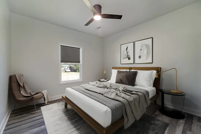 a bedroom with a bed and a lamp