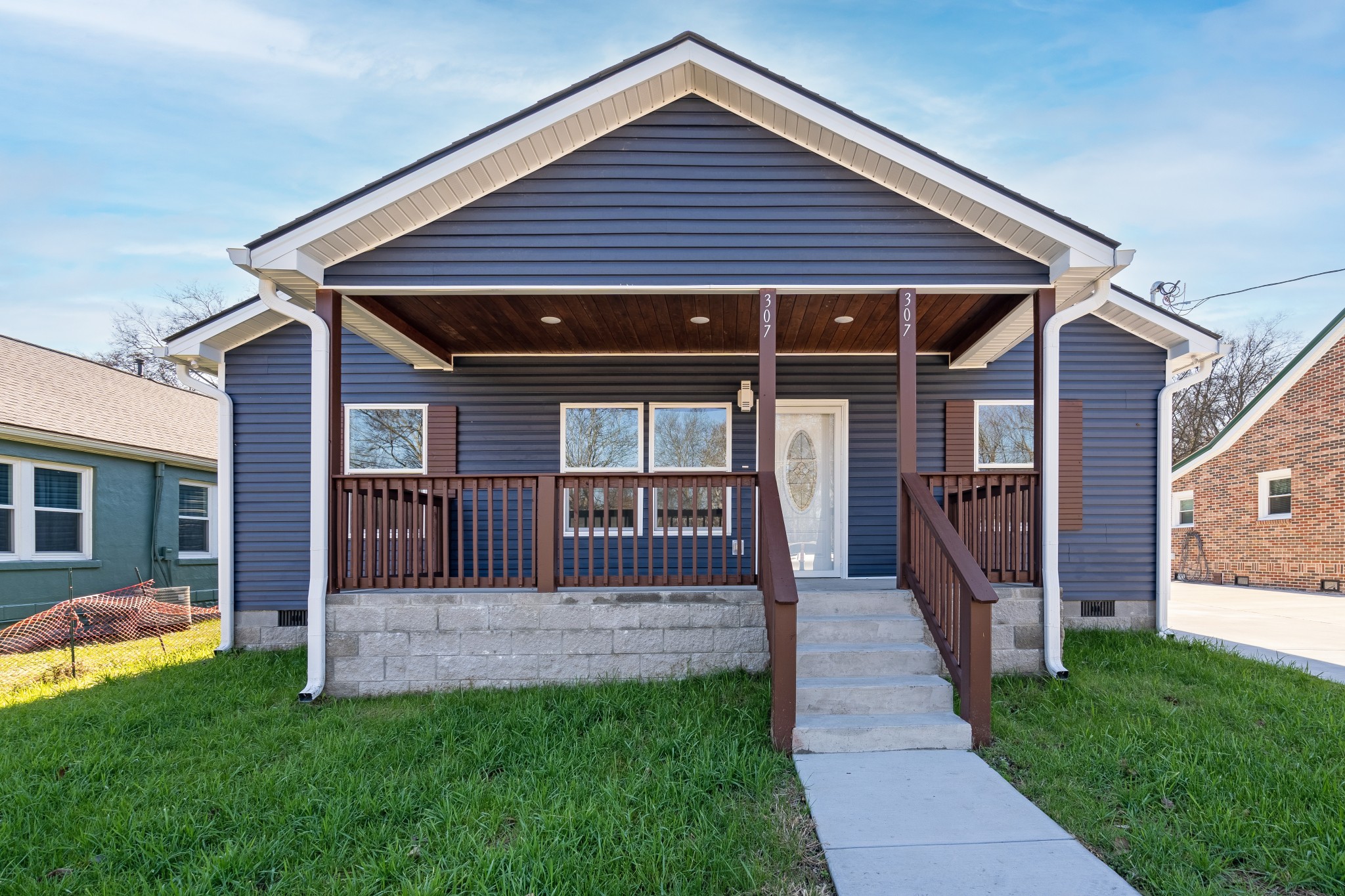 307 Wall Street Mount Pleasant, TN 38474 - Photo 2 of 33 a front view of a house with a yard