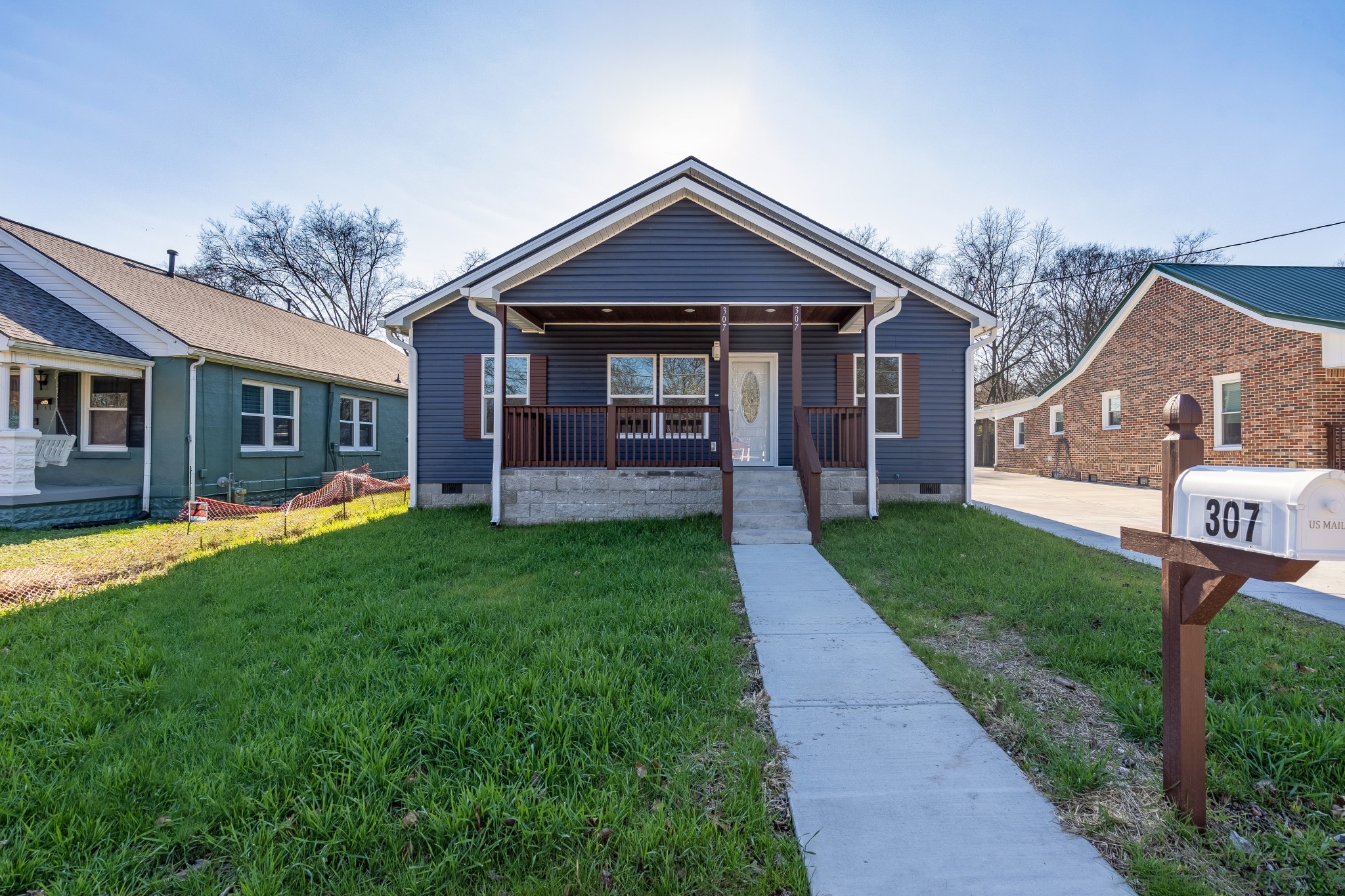307 Wall Street Mount Pleasant, TN 38474 - Photo 3 of 33 a view of a house with a yard and porch