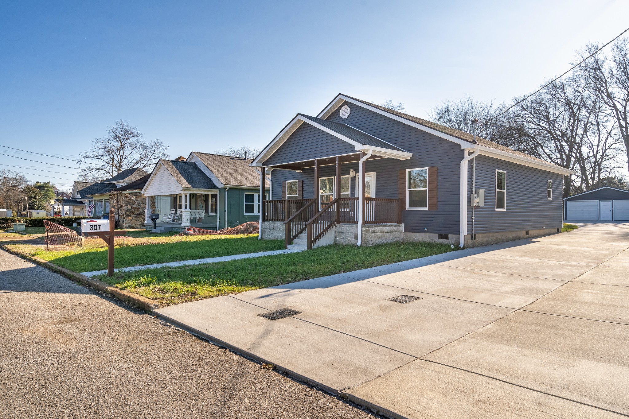 307 Wall Street Mount Pleasant, TN 38474 - Photo 5 of 33 a view of a house with a big yard plants and large trees