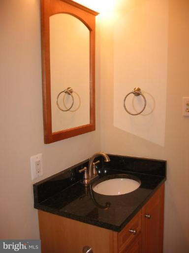 6635 Cornell Drive Alexandria, VA 22307 - Photo 6 of 10 a bathroom with a sink and a mirror