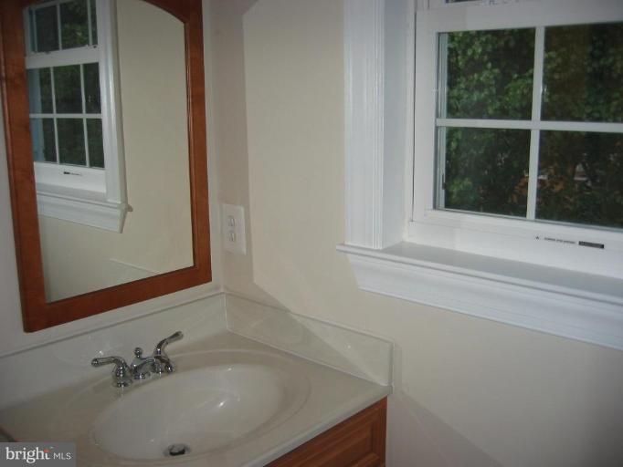 6635 Cornell Drive Alexandria, VA 22307 - Photo 7 of 10 a bathroom with a sink and a mirror