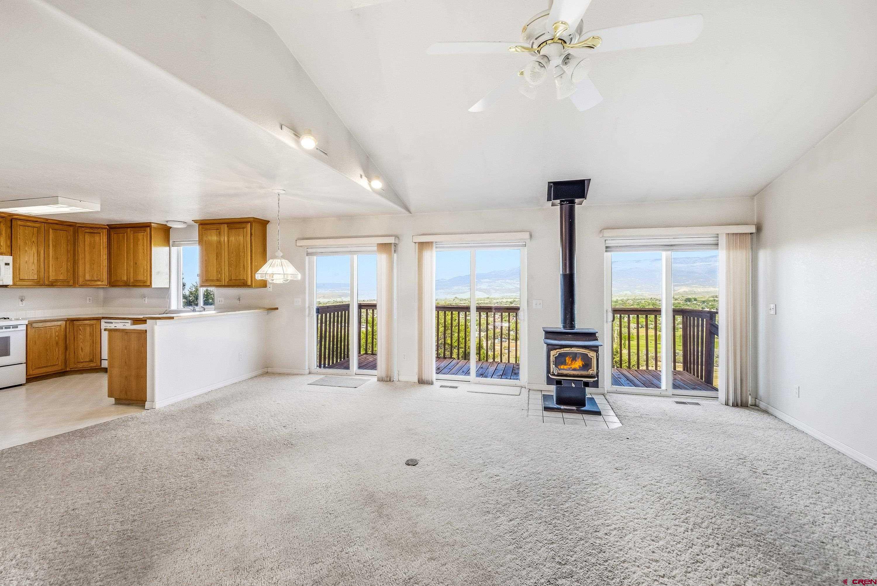 24239 Valley View Circle Cedaredge, CO 81413 - Photo 7 of 18 a living room with furniture and a large window