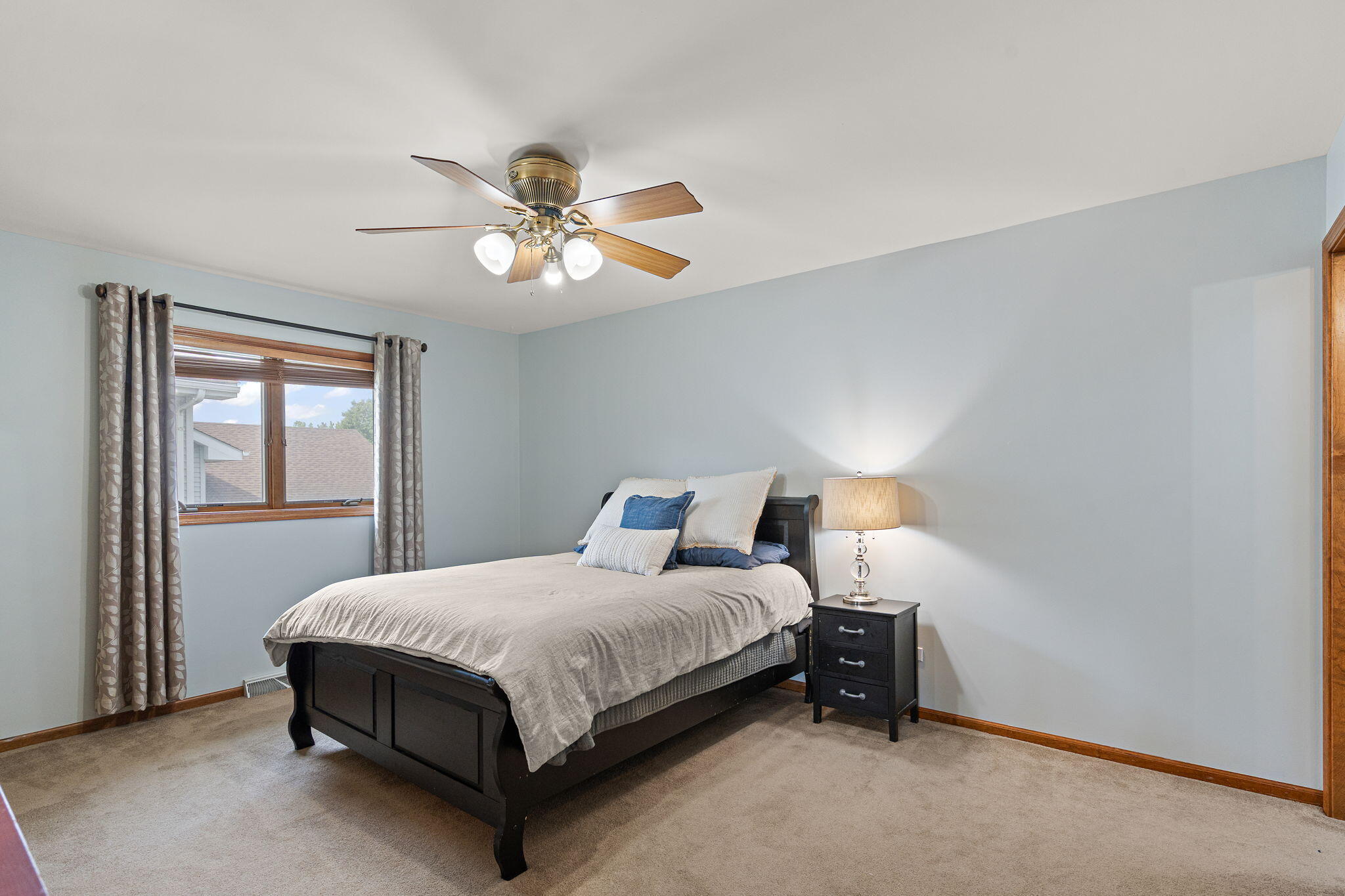 8987 Calhoun Place Crown Point, IN 46307 - Photo 16 of 28 a bedroom with a bed chandelier and a window