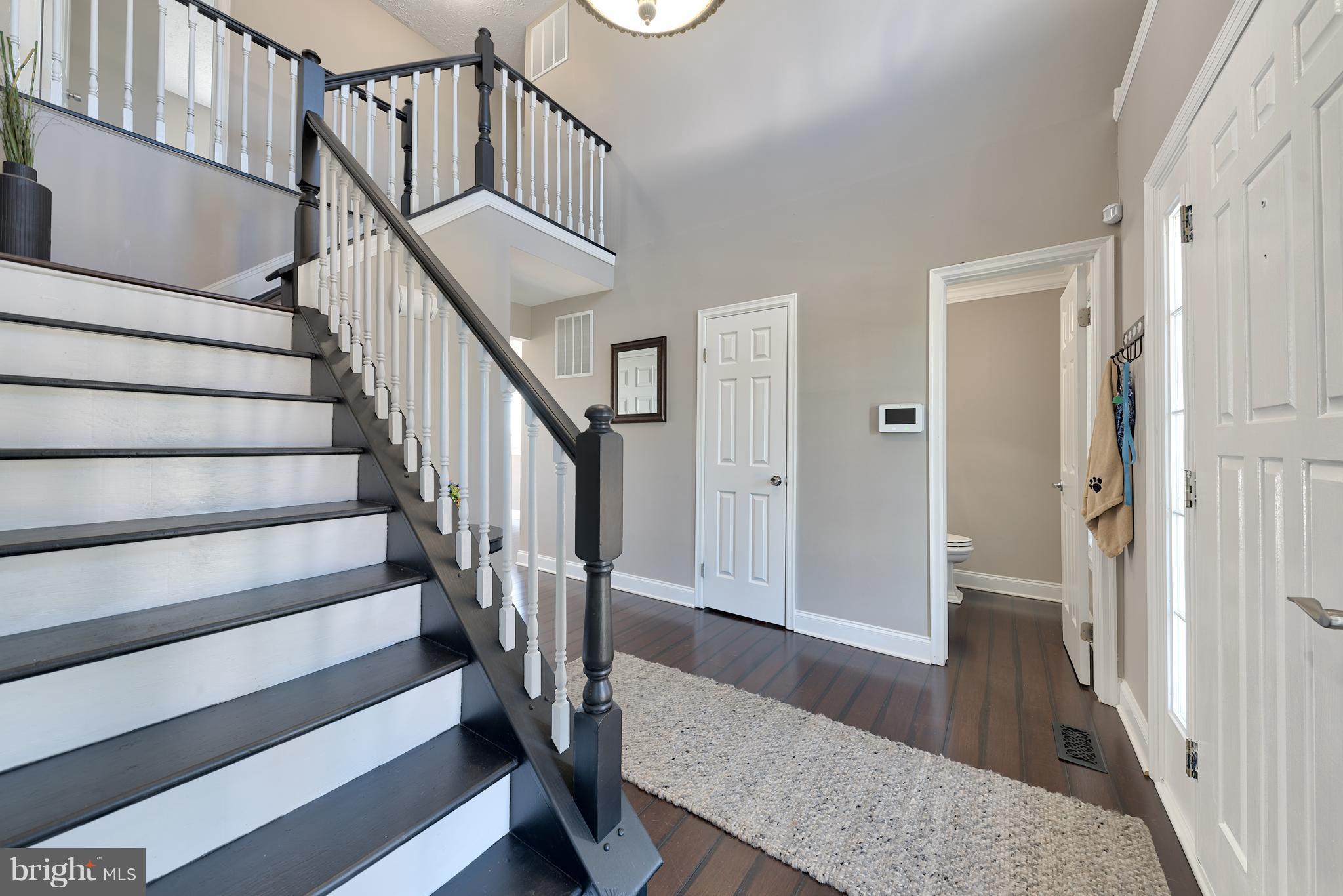9231 Bretton Reef Road Baltimore, MD 21234 - Photo 13 of 30 Chic Contrasting Stairs from Main Floor to Second