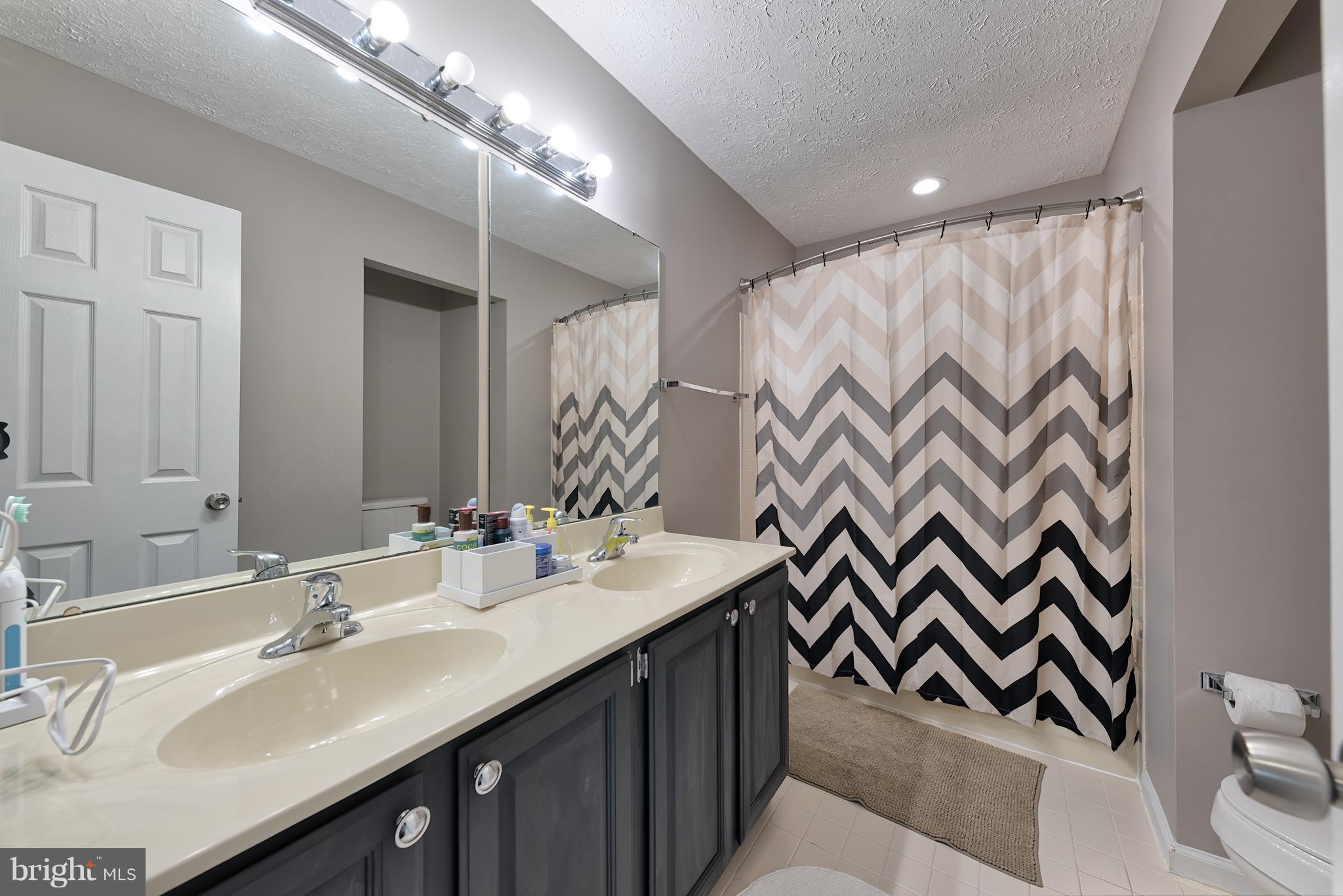 9231 Bretton Reef Road Baltimore, MD 21234 - Photo 14 of 30 Hall Bath on Second Level w/ Dual Sink Countertop