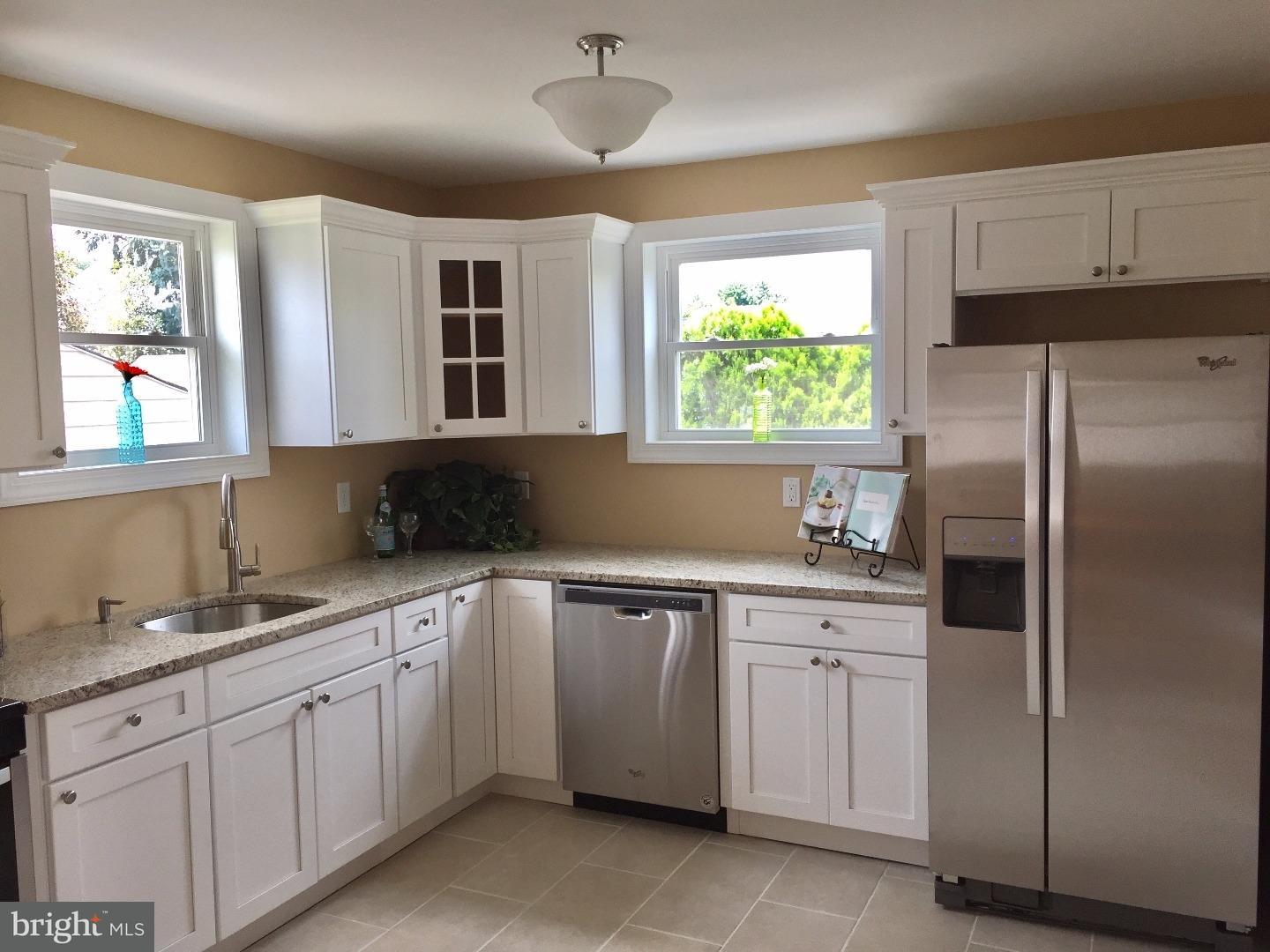 44 Lanci Road Maple Shade, NJ 08052 - Photo 8 of 25 a kitchen with a sink window and cabinets