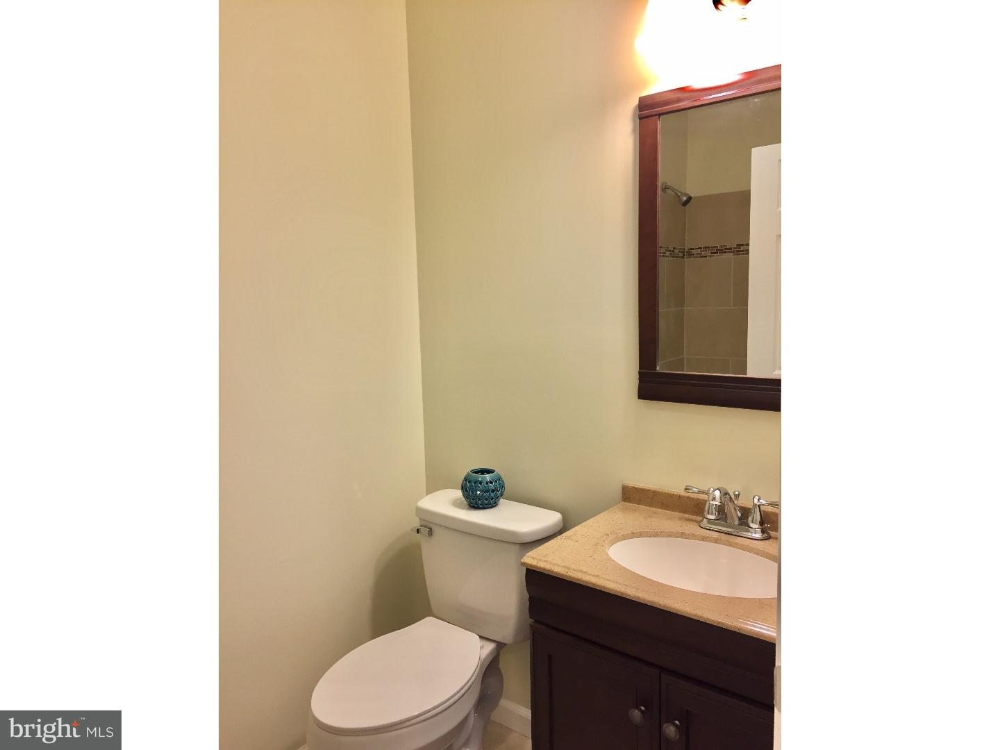 44 Lanci Road Maple Shade, NJ 08052 - Photo 9 of 25 a bathroom with a toilet sink and mirror